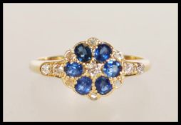 AN 18ct GOLD SAPPHIRE AND DIAMOND RING