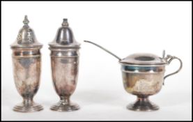 A mid 20th Century silver hallmarked condiment cruet set consisting of salt and pepper shakers /