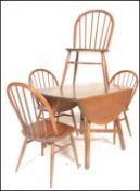 A mid century Golden Dawn beech and elm Windsor pattern dining room suite to include a drop leaf