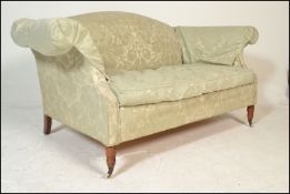 A good Regency style upholstered two seat sofa settee. Raised on turned legs with flared arms and
