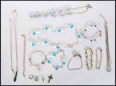 A selection of stamped 925 silver jewellery to include chain bracelets, pendants, a multi chain