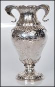 A late 19th / early 20th Century continental silver vase of tapering form. The vase having molded