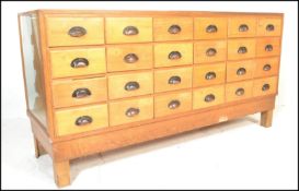 A good early 20th century 1930's Art Deco golden oak multi drawer vintage haberdashery shop
