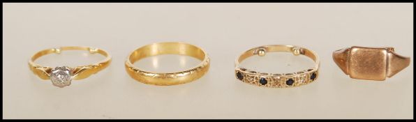 An 18ct gold band ring being Birmingham hallmarked having rubbed decoration to the outside of the