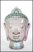 A vintage retro 20th Century glass Buddha head featuring beaded head dress with moulded features.