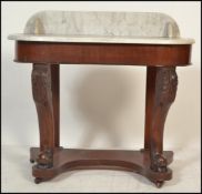 A Victorian 19th century mahogany and marble duchess console table. Raised on bun feet with lower