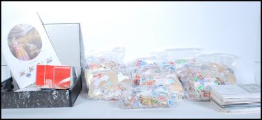 A large box of kiloware stamps dating from the 20th century, mostly British and commonwealth