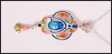 A stamped 925 silver necklace having an Art Nouveau style pendant with enamelled panels. Weight 9.