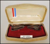 A pair of silver hallmarked gentleman's cufflinks in the form of Concorde, within the original