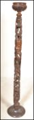 A 20th Century African tribal carved hardwood totem, the carved totem made from several pieces which