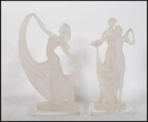 Two cast frosted resin Art Deco style figurines to include a couple dancing and a female dancing