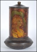 A early 20th Century advertising biscuit tin of cylindrical form depicting two classical ladies,