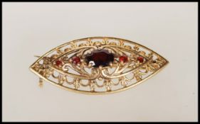 A 9ct gold vintage boat shaped brooch having pierc