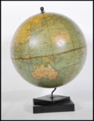 A vintage 1930's Art Deco desk top Philip's Challenge globe, the map depicting shipping routes and