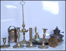 A collection of brass items dating from the 19th century onwards to include a brass mantel clock