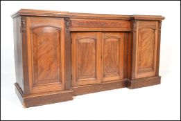 A Victorian 19th century mahogany breakfront inverted sideboard. Raised on a plinth base with
