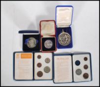 A silver Edward Prince of Wales coin in its original box together with two Britain's First Decimal