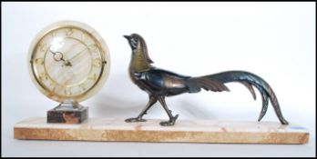 A 20th Century  1930's Art Deco mantel clock having circular onyx dial to left with gilt Arabic