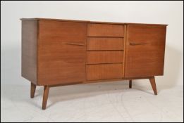 A vintage retro 20th Century teak wood breakfront sideboard credenza, central bank of four drawers