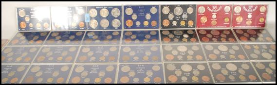 A collection of cased Queen Elizabeth II Coinage Of Great Britain to include Crowns Of Great Britain