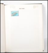 A 20th Century world stamp album containing stamps dating from the 19th Century to include