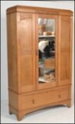 A late 19th / early 20th Century high Victorian light oak single door wardrobe having blind fretwork