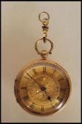 A mid 20th Century hallmarked 18ct gold pocket watch having a gilt dial with floral decoration and
