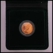 A 22ct gold proof sovereign dated 1980 having the Queens head facing right with George and the