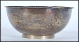 A 20th Century silver finger bowl by Asprey raised on a footed base. Hallmarked London 1916.