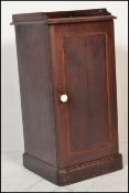 A Victorian 19th century mahogany pot cupboard raised on a plinth base with full length door