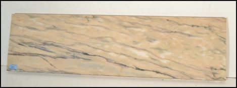 A 20th Century marble topped French console table having gilt reeded square legs, the frieze