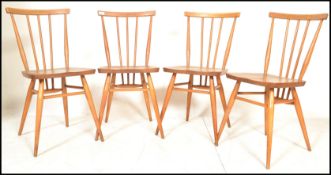 A set of four vintage retro 20th century Ercol beech and elm Windsor model 391 dining chairs