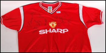 A Manchester United Football Shirt Signed By Arthur Albiston, Clayton Blackmore, Lee Martin, Sammy