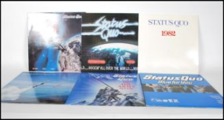 A collection of long play LP vinyl records by Status Quo to include If You Can't Stand The Heat,