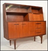 A stunning mid century teak wood Danish inspired mid top sideboard credenza. Three drawers to the