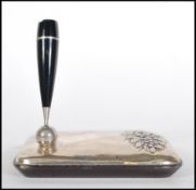 An unusual Italian silver hallmarked 925 pen stand, in relief floral spray with bakelite pen