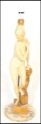 An early 20th Century chalk ware table lamp by Oliver Messel modelled as a classical figure of a