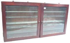 STAINED WOOD AND GLAZED TWIN DOOR DIECAST DISPLAY CABINET