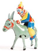 1940'S CLOCKWORK TINPLATE BLOMER AND SCHULER CLOWN JOCKEY