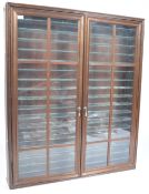 STAINED WOOD AND GLAZED TWIN DOOR DIECAST DISPLAY CABINET