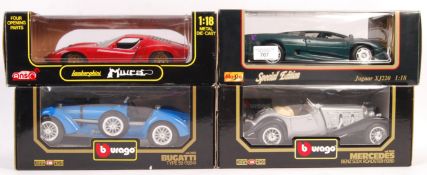 FOUR BOXED 1/18 SCALE DIECAST MODEL CARS