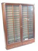 STAINED WOOD AND GLAZED TWIN DOOR DIECAST DISPLAY CABINET