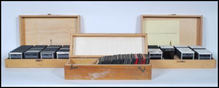 A collection of 20th Century slides, contained wit