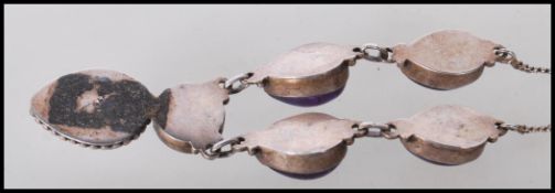 A stamped 925 silver necklace being set with a col