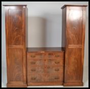 A 19th Century flamed mahogany sentry box triple w