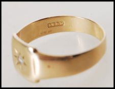 A hallmarked 9ct gold signet ring having a square