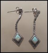 A pair of Art Deco style ladies drop earrings bein