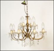 A six branch, twelve light gilt metal and cut glas