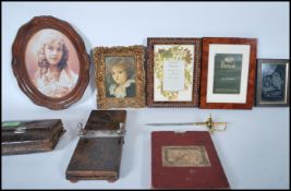 A collection of items to include picture frames, o