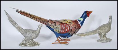 A pair of silvered composite models of Pheasants t